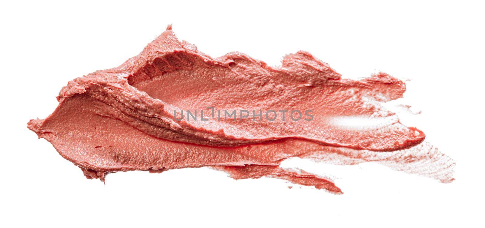 Stains of a pink lipstick isolated on white background, close up.