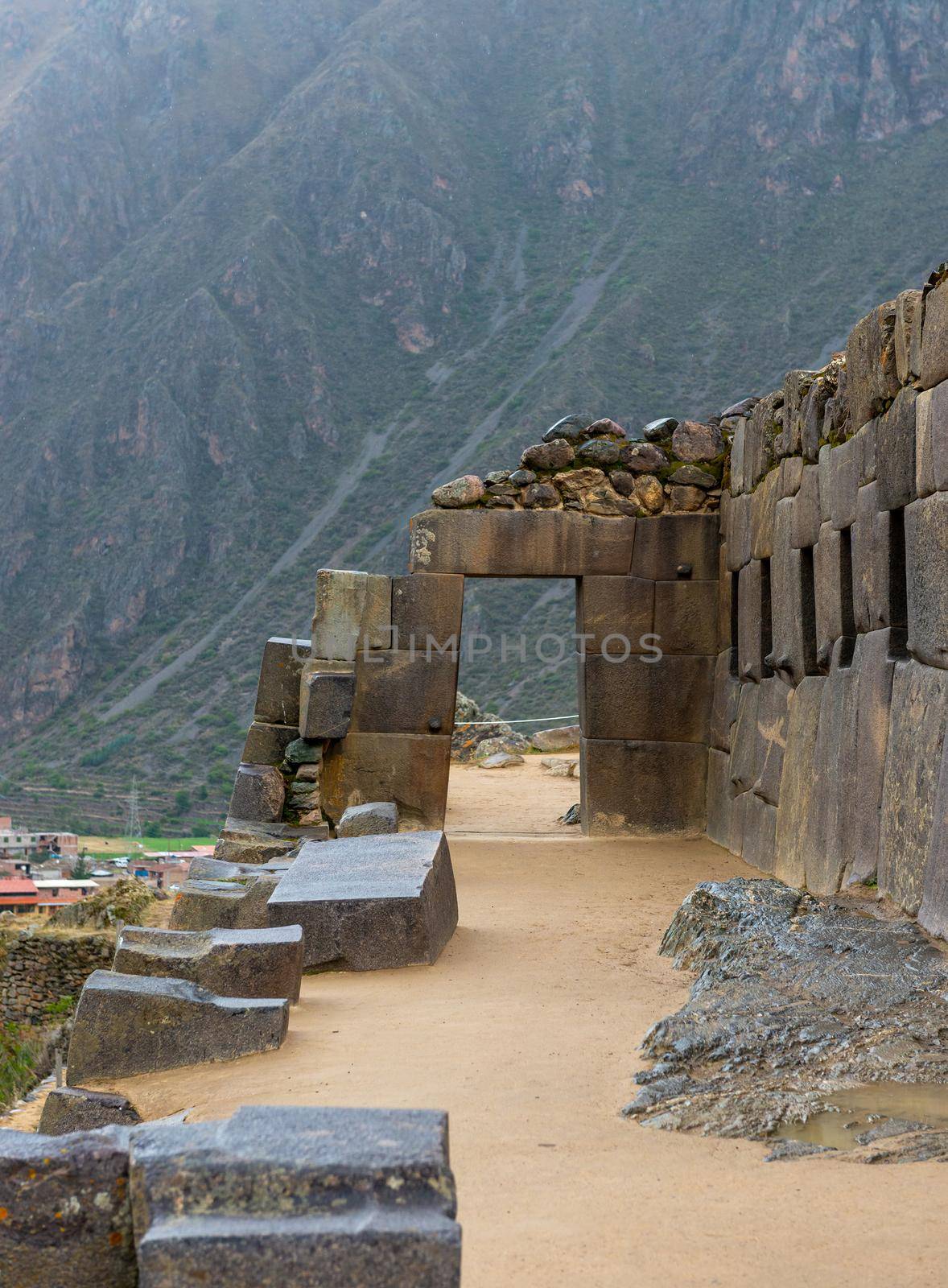 The massive stone passage of abandoned Inca fort in Ollantaytambo, Peru