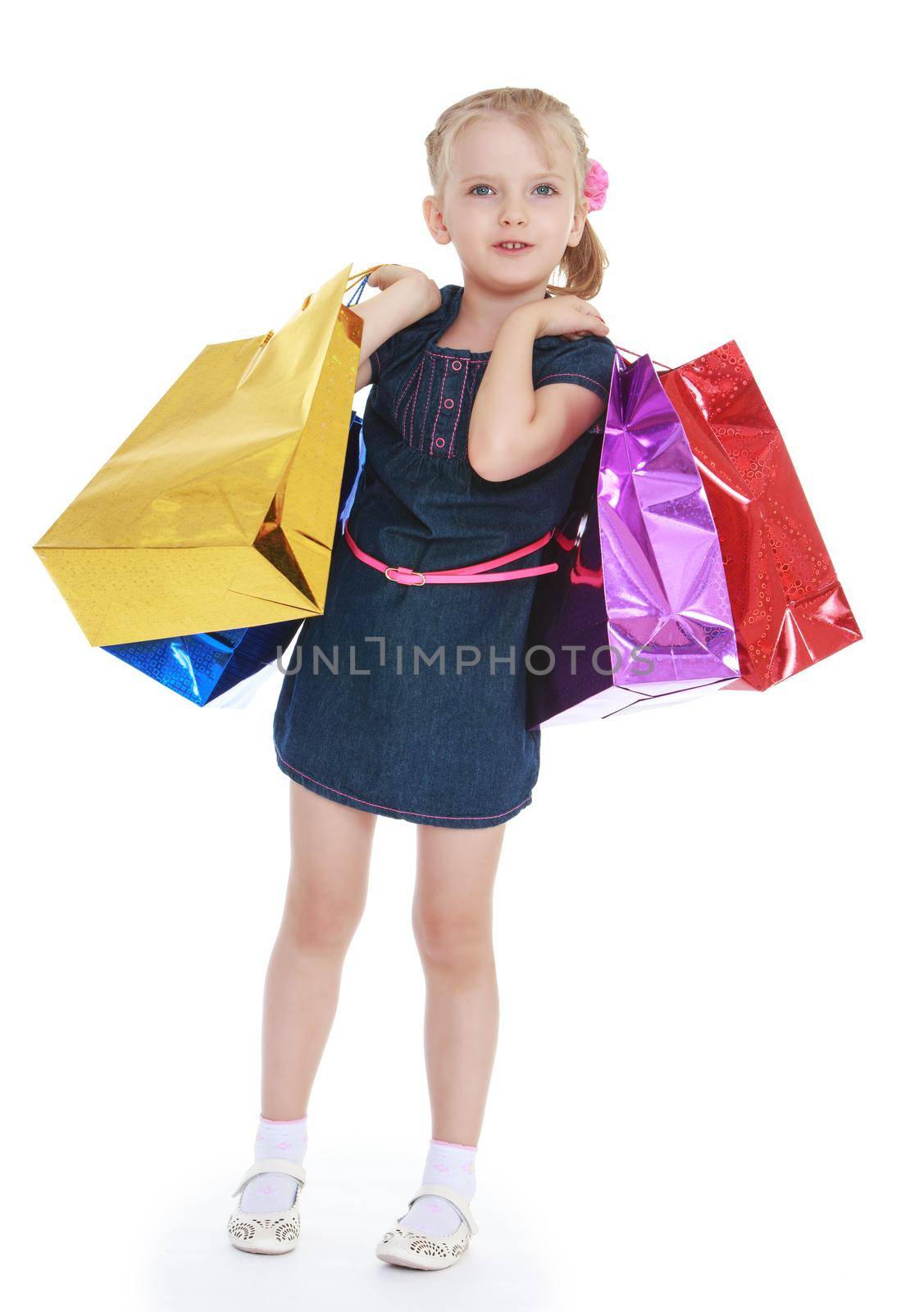 Little girl packages in hands. Isolated on white background .