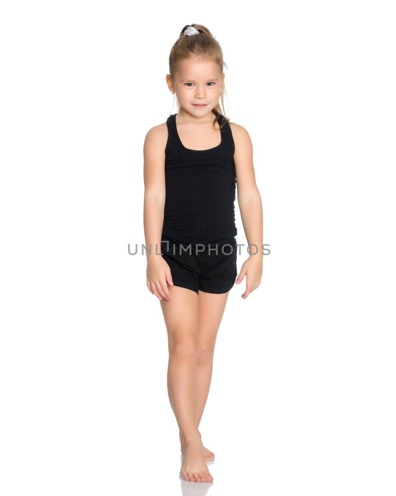 A gymnast girl prepares for the exercise. The concept of childhood and sport, a healthy lifestyle. Isolated on white background.