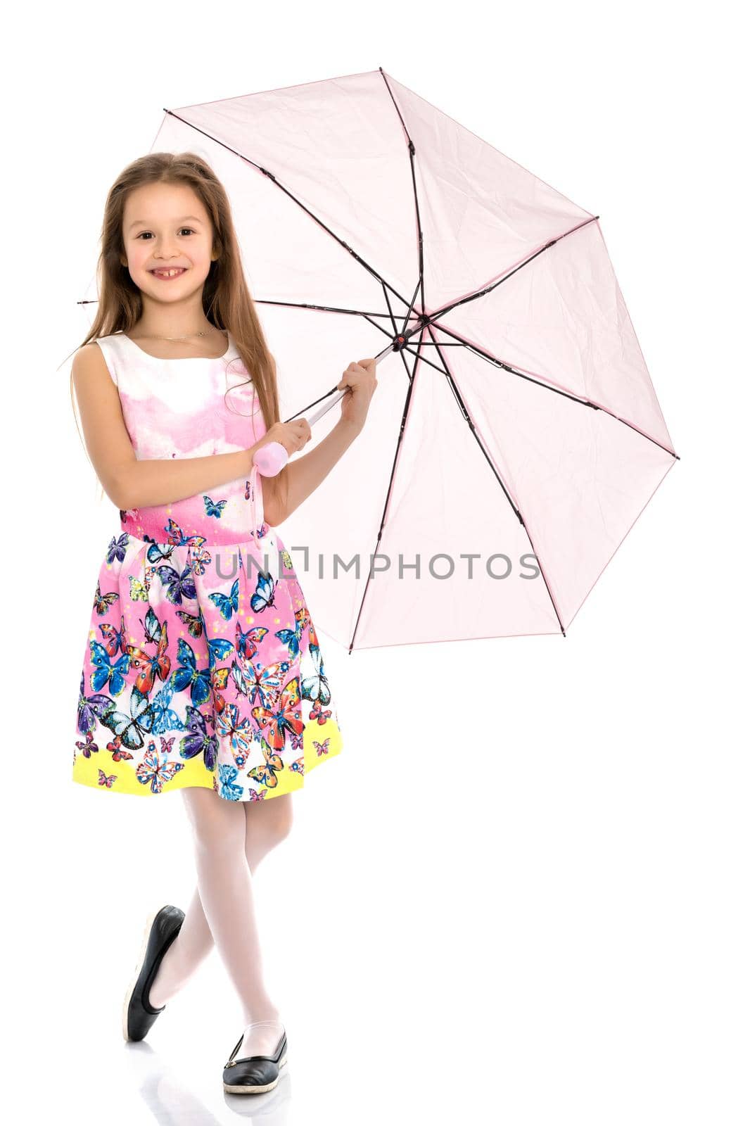 Beautiful teenage girl, in a summer dress under an umbrella. The concept of a happy childhood, summer outdoor recreation. Isolated on white background.