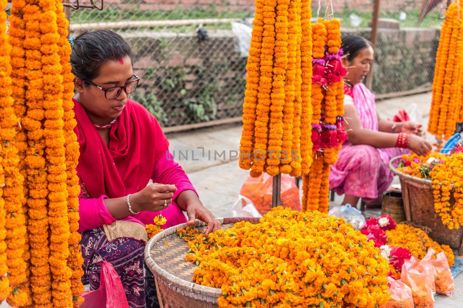 People sell flower necklaces near to Kathmandu Durbar Square by tan4ikk1