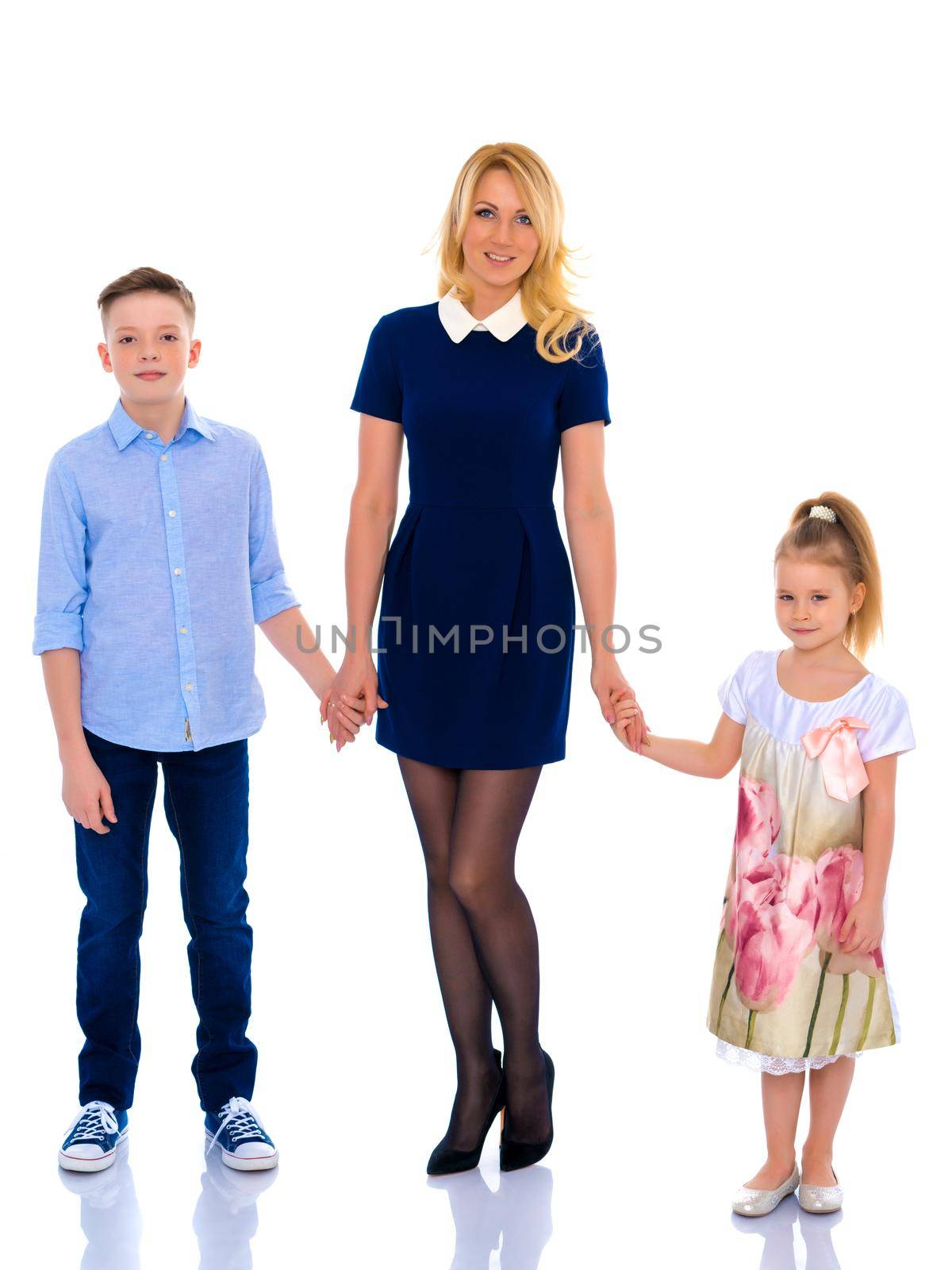 Happy family mom and two children hold hands. The concept of family values, the upbringing of children. Isolated on white background.