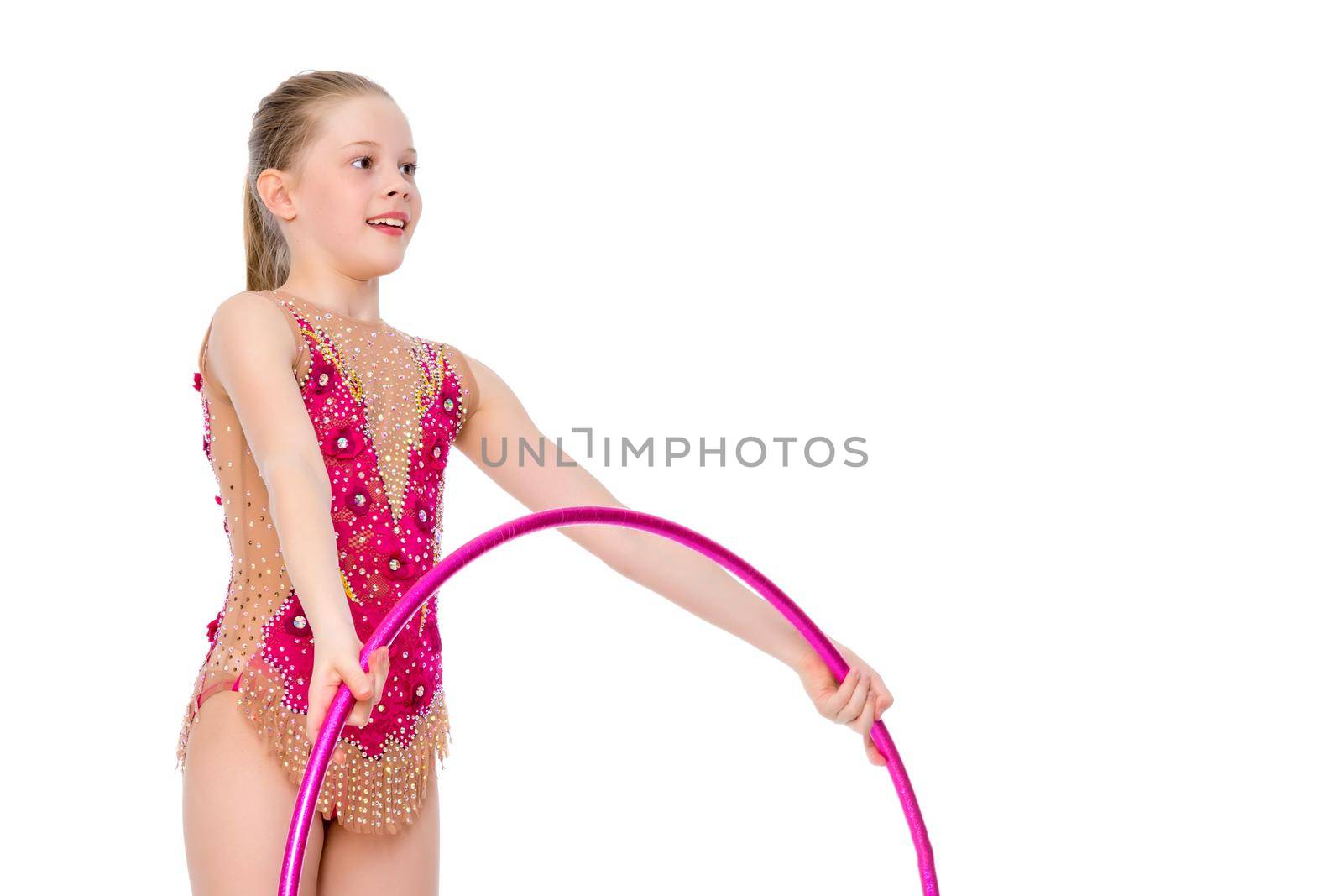 A girl gymnast performs an exercise with a hoop. The concept of gymnastics and fitness. Isolated on white background.