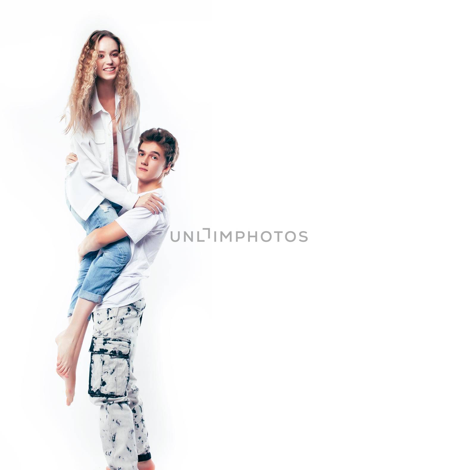 young attractive couple together having fun happy smiling isolated on white background, emotional posing, lifestyle people concept close up