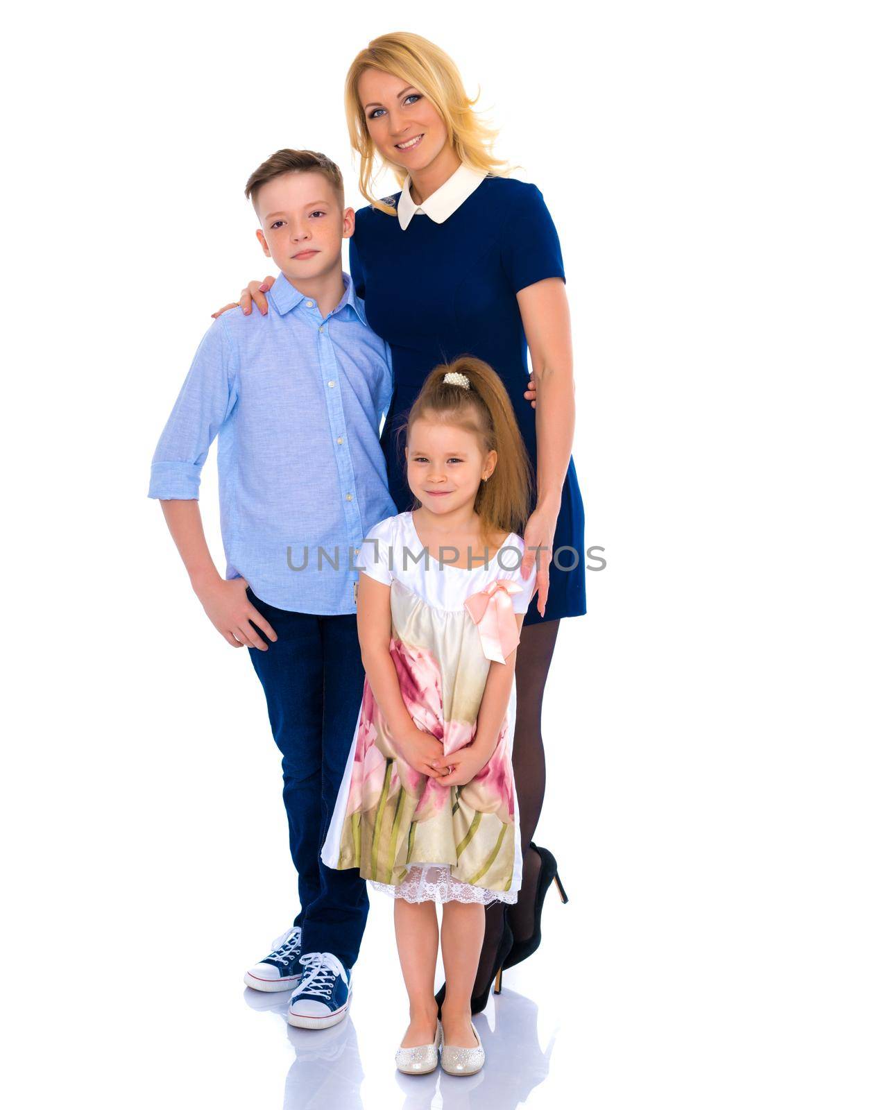 Happy family mom and two children hold hands. The concept of family values, the upbringing of children. Isolated on white background.