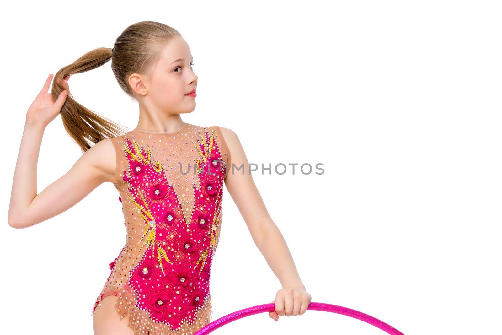 A girl gymnast performs an exercise with a hoop. The concept of gymnastics and fitness. Isolated on white background.