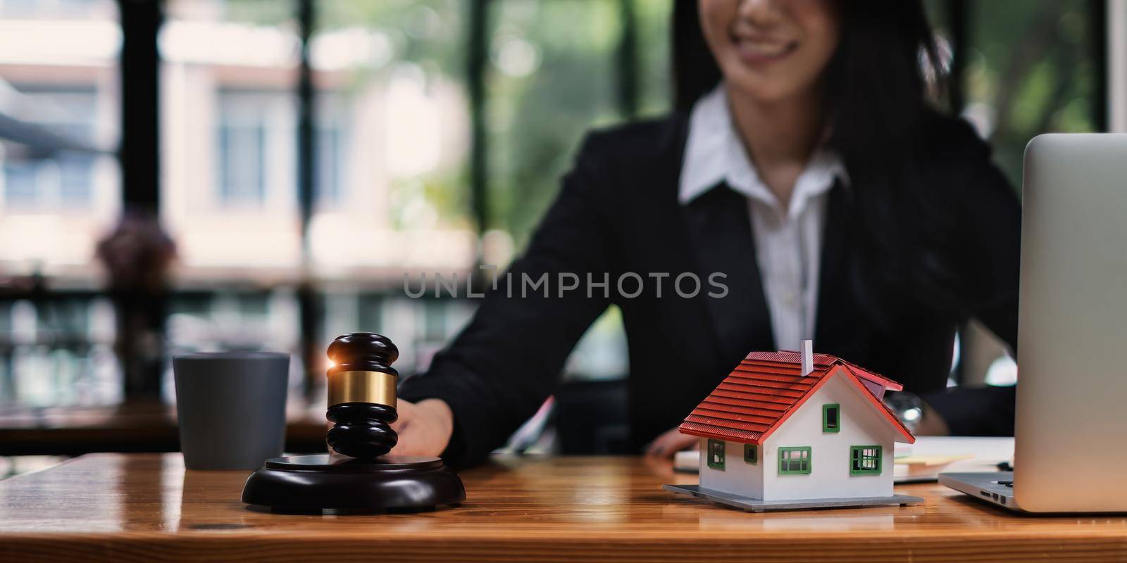 Business woman or lawyers discussing contract papers on wooden desk in office. Law, legal services, advice,Judge auction and real estate concept. by itchaznong