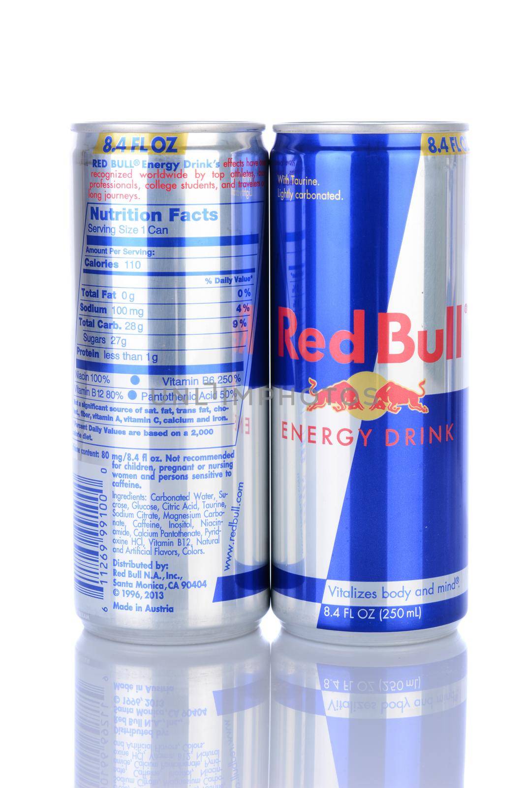 IRVINE, CA - February 06, 2014: Front and bacl of two Red Bull Energy Drinks. Red Bull is the most popular energy drink in the world, with 5.2 billion cans sold in 2012.