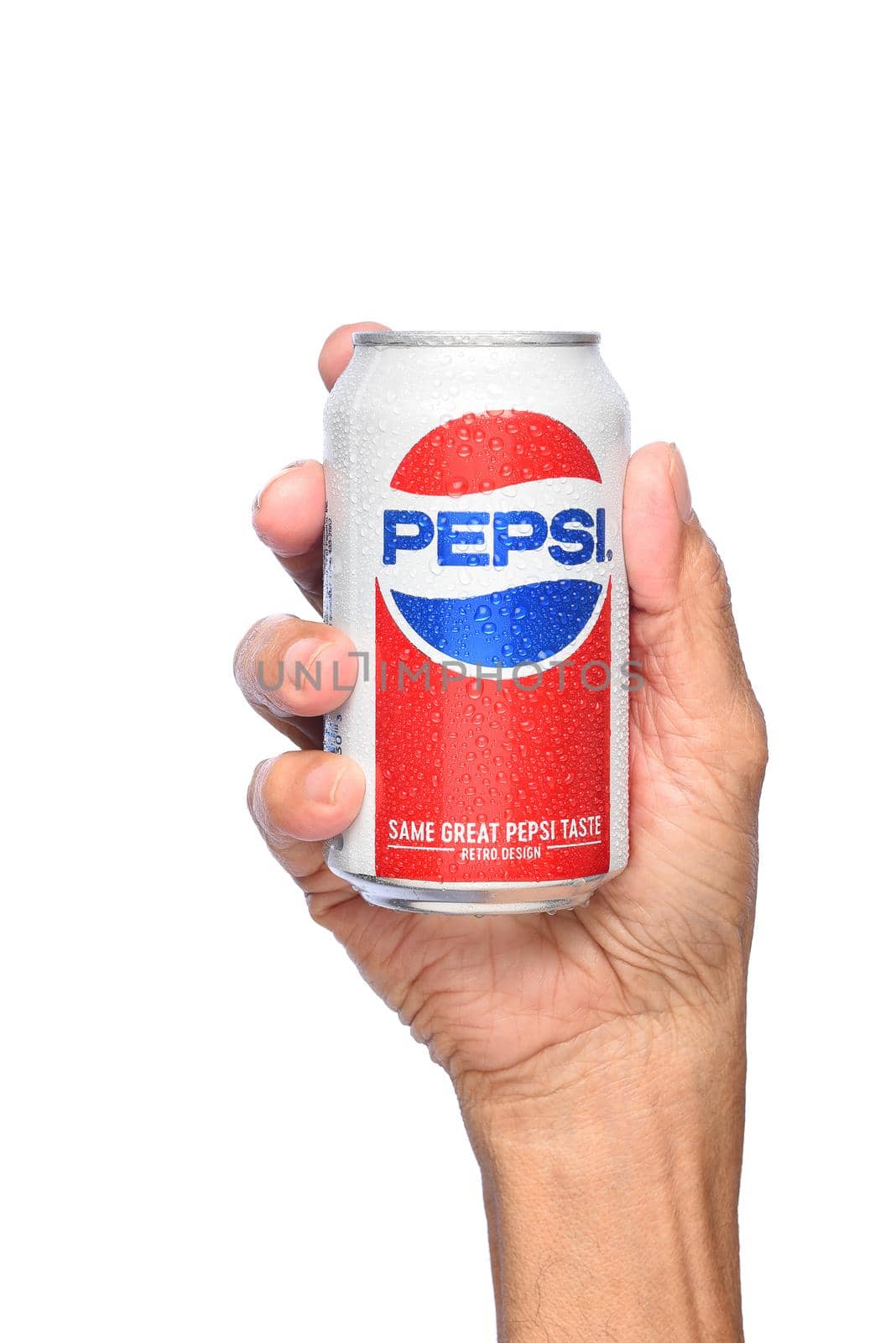 Closeup of a hand holding a cold can of Pepsi Cola.  by sCukrov