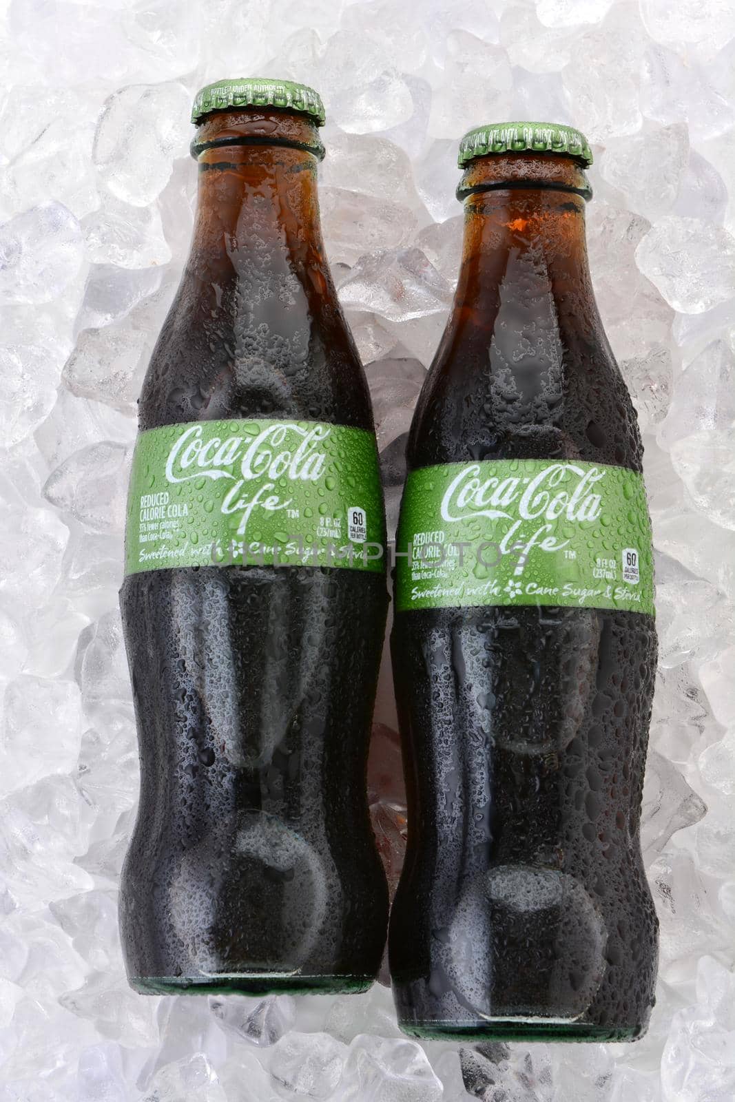 IRVINE, CA - FEBRUARY 15, 2015: Coca-Cola Life bottles on ice. A reduced calorie soft drink sweetened with cane sugar and Stevia, containing 60% of the calories of Classic Coke.