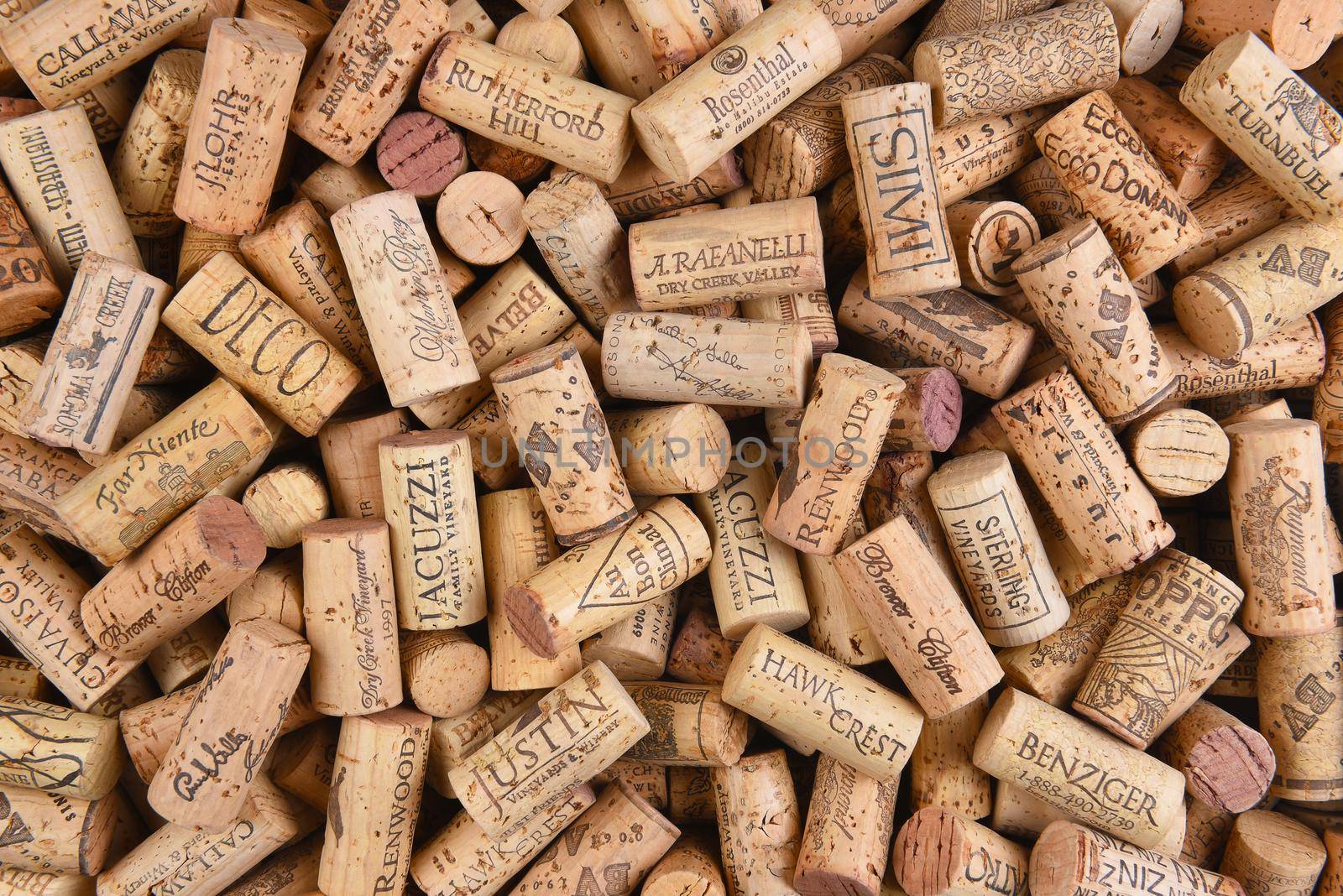 IRIVNE, CALIFORNIA - FEBRUARY 14, 2018: A pile of Predominently California wine corks with a variety of logos and names. 