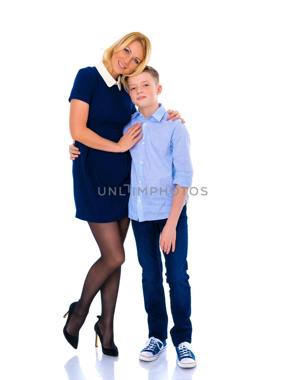 Beautiful young mother with her teen son in the studio. by kolesnikov_studio