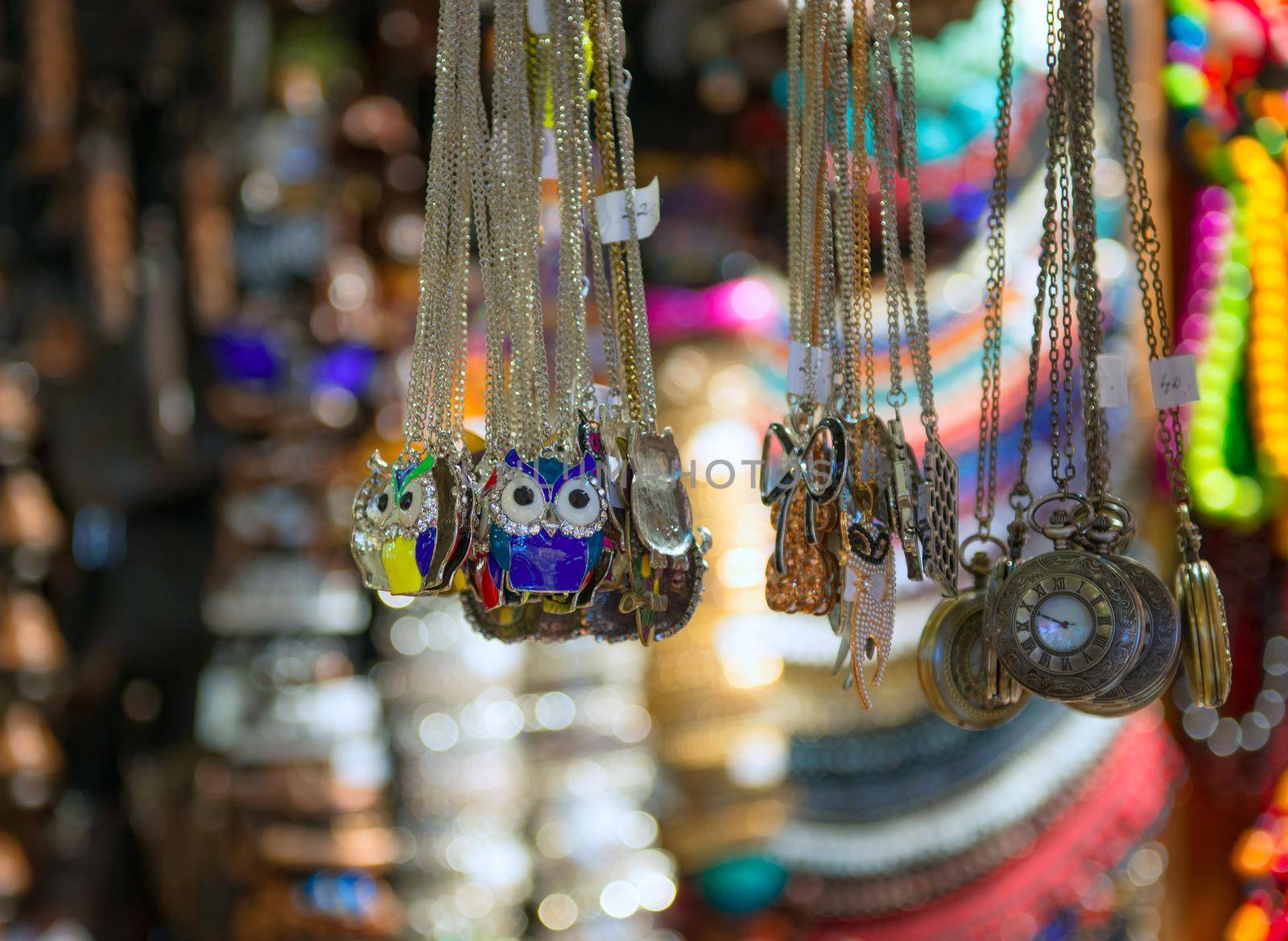 Old souvenir shop with necklaces and tokens on the street of Warsaw, Poland