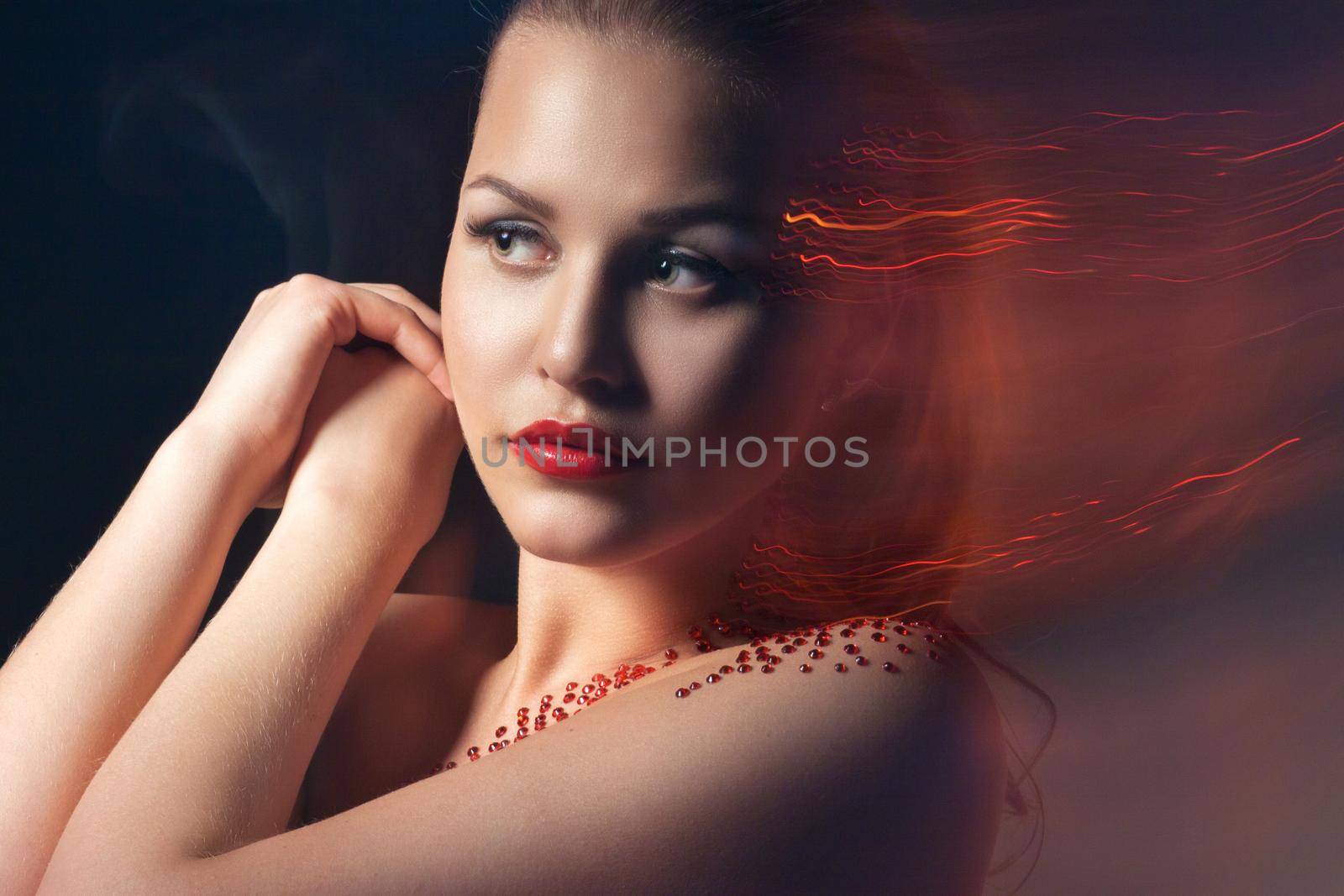 Fashion Blonde Model Portrait. Professional Red Makeup over black background