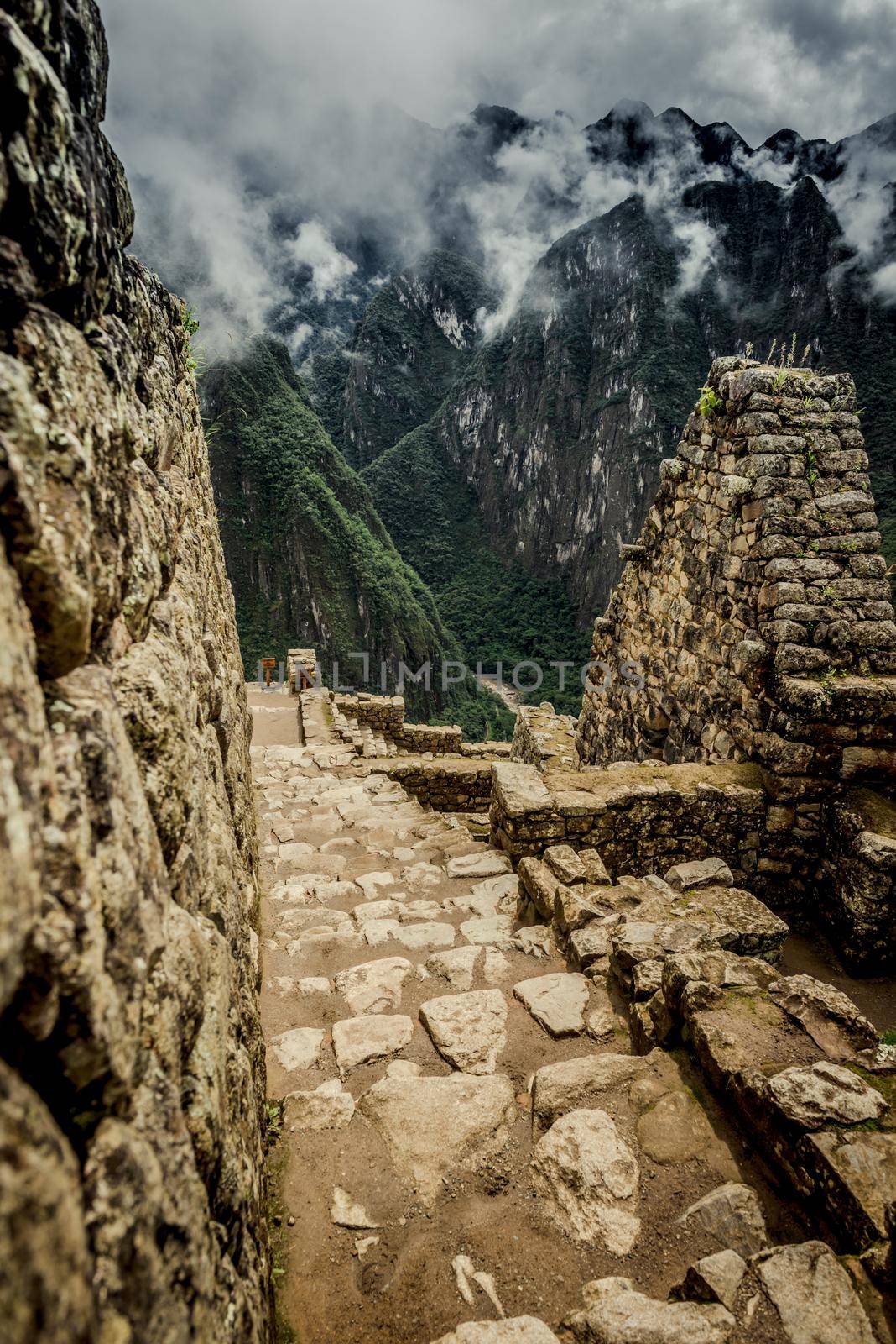 Pillars of incas architecture in front of majestic view of Machu Picchu