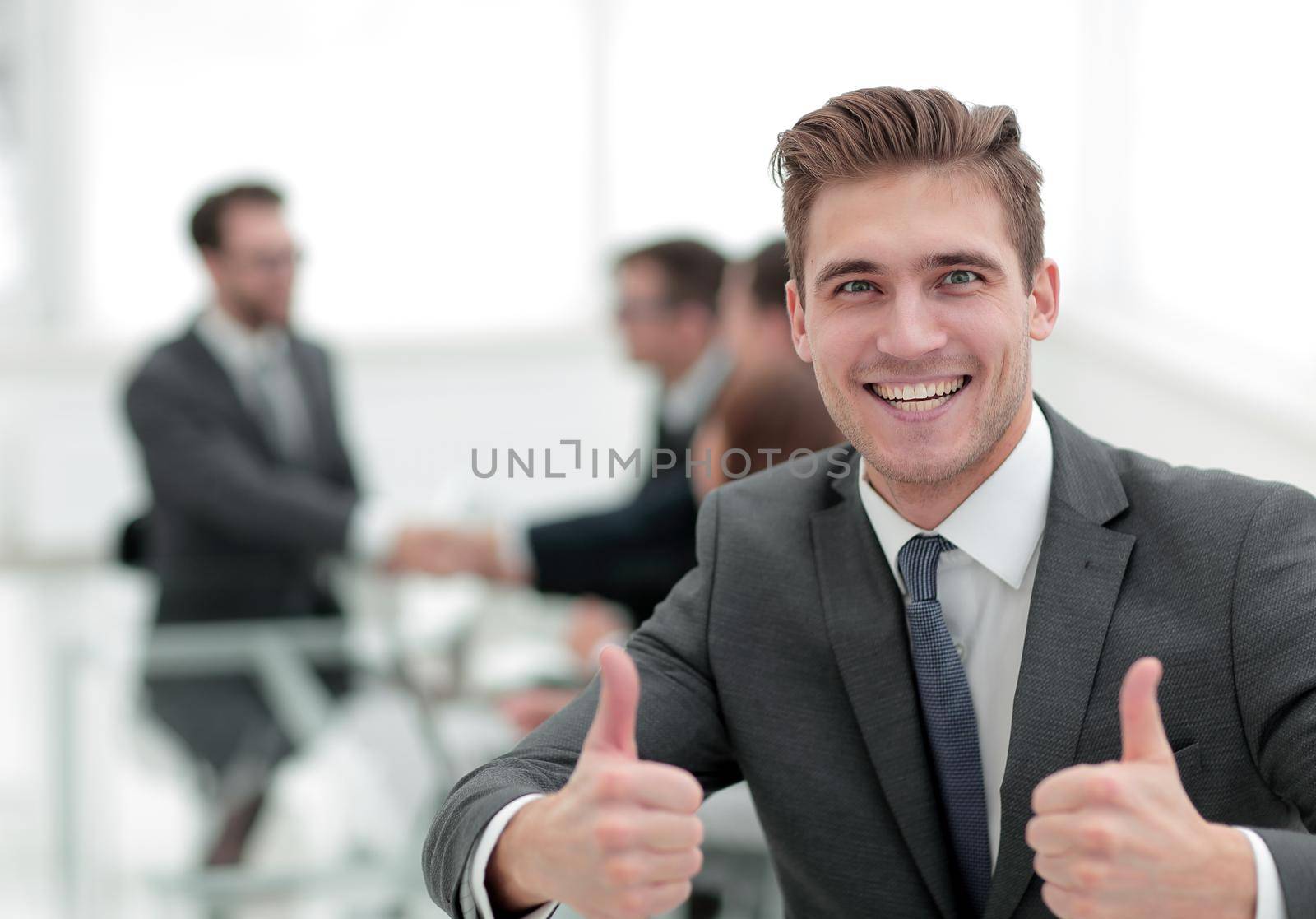 happy businessman showing thumbs up by asdf