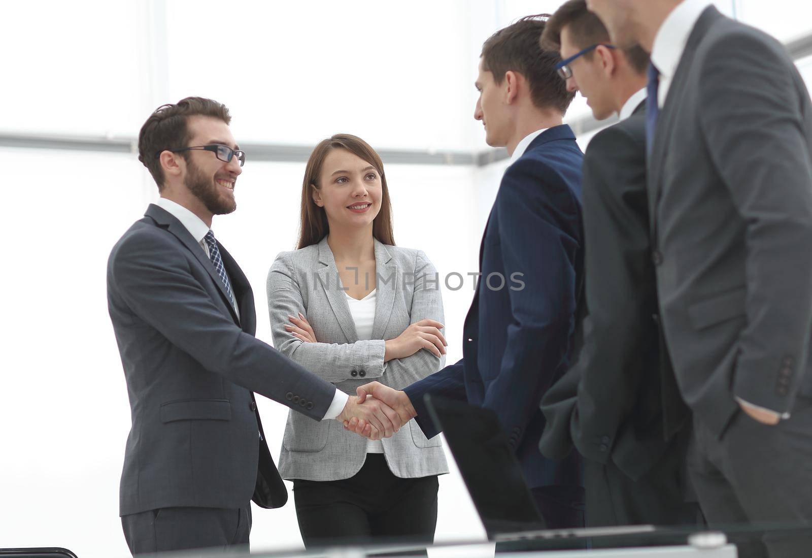 business partners shaking hands on meeting