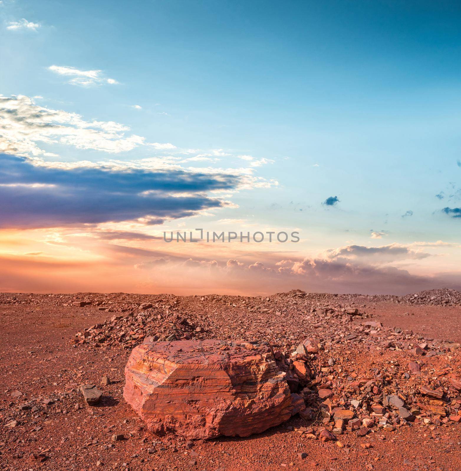 red land with stones in iron oxide quarry in Kryvyi Rih, Ukraine