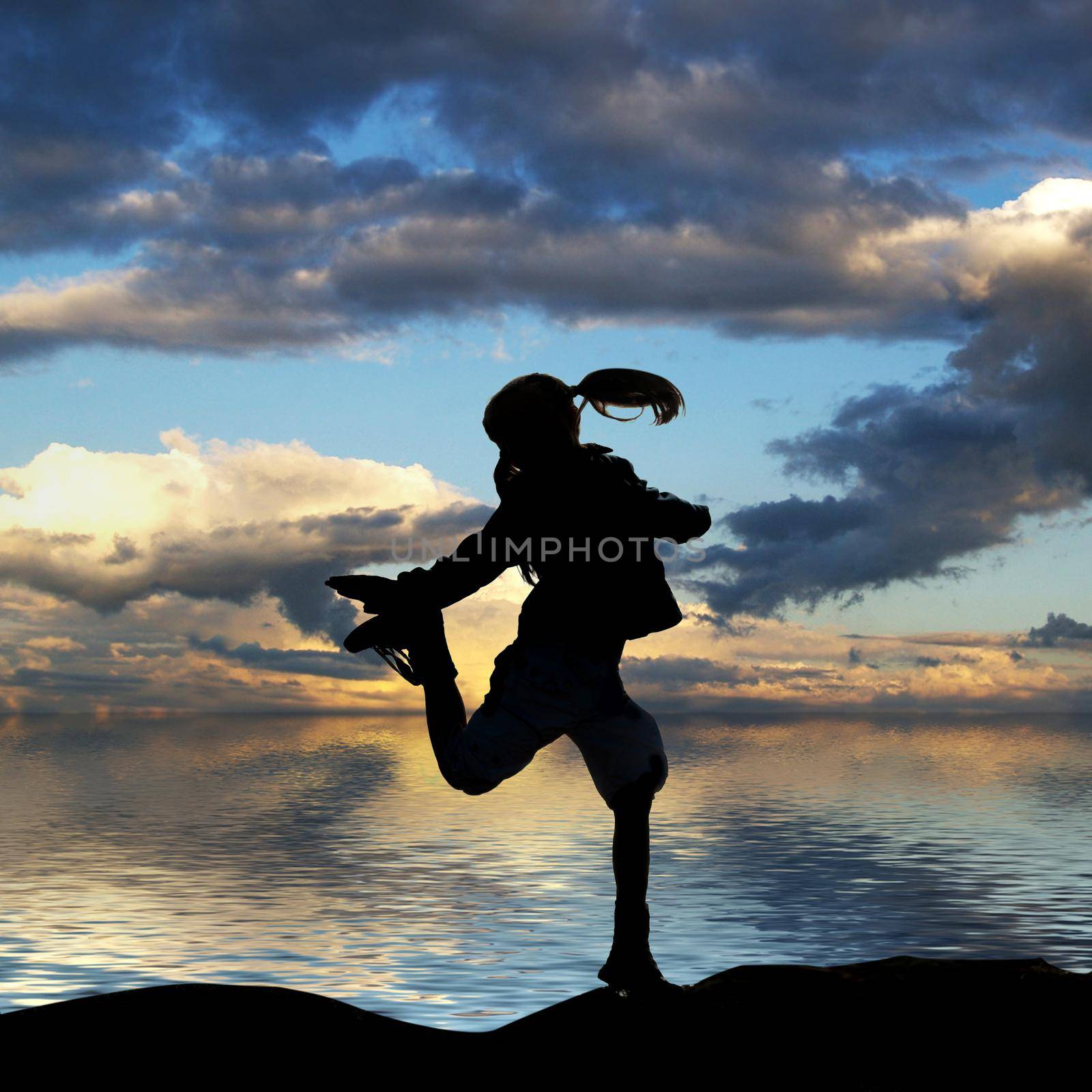 little girl jumping on a background of the sea