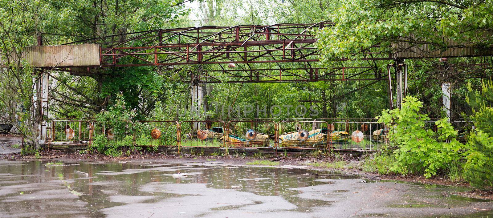 abandoned amusement park with cars in Pripyat