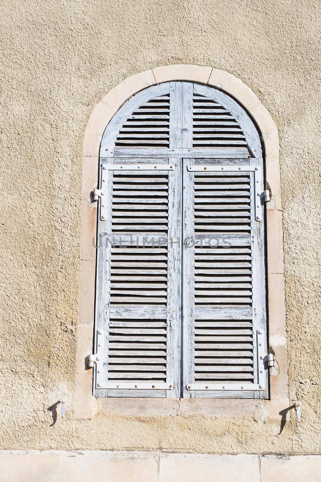 Old window shutters of an mediterranean house, vintage background