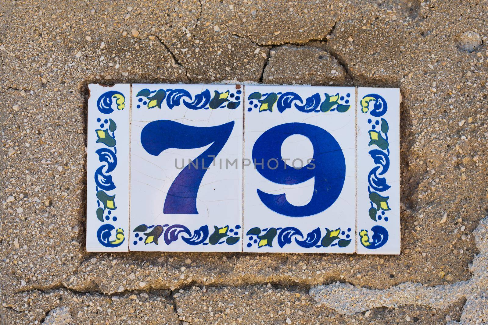House number seventy nine 79 close up, ceramic plate.