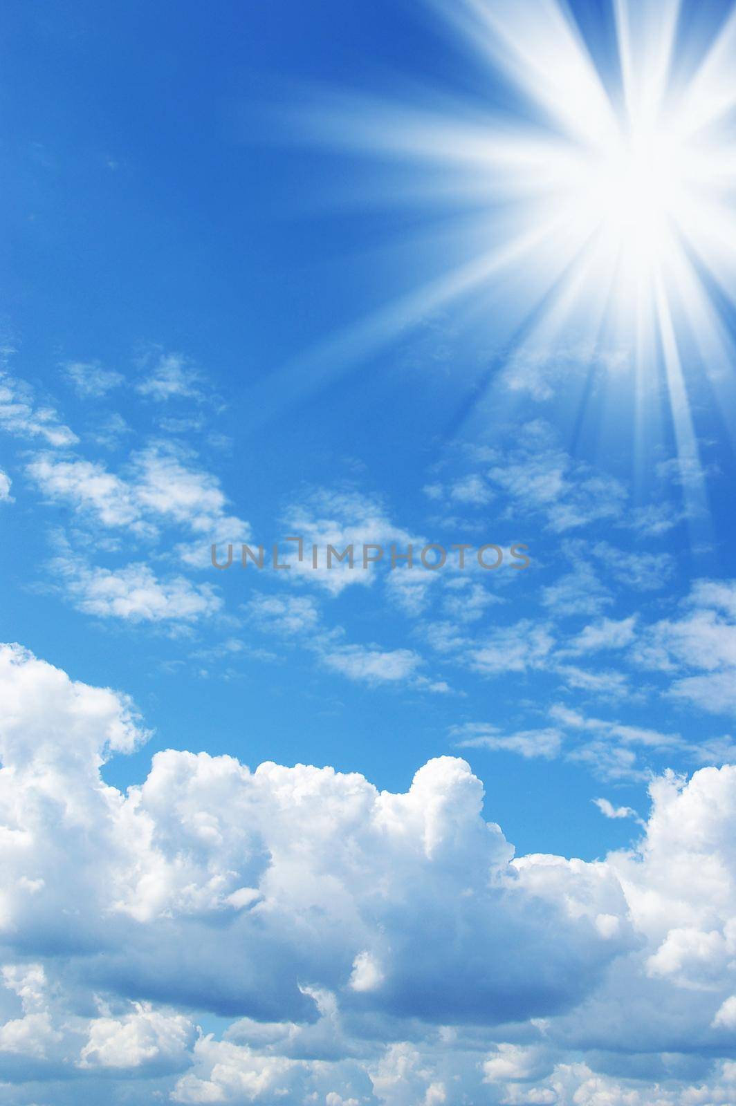 White clouds and sun in a blue sky
