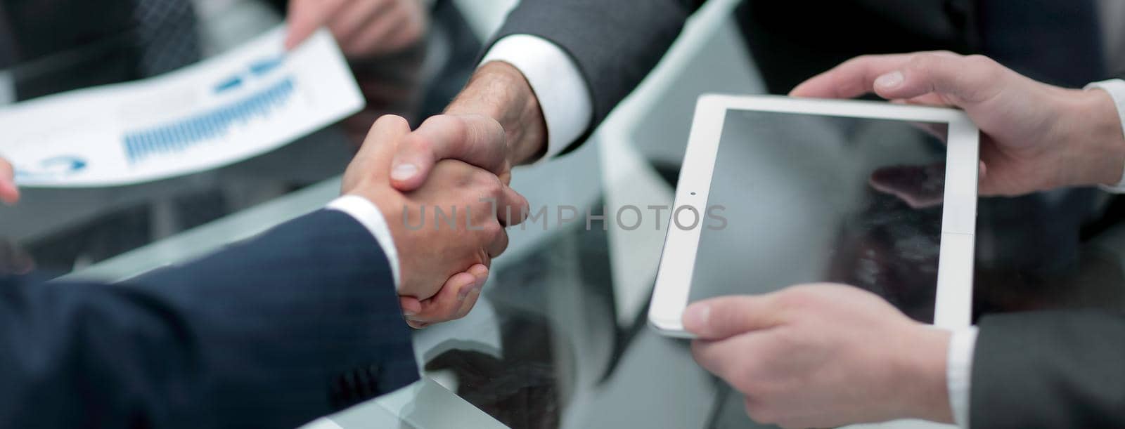 close up.businessman looking at tablet screen by asdf