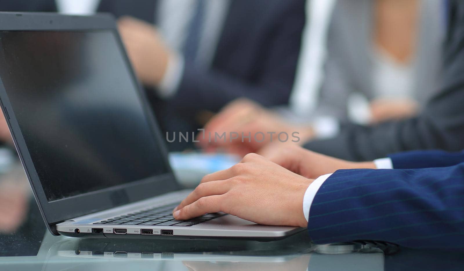 businessman typing on laptop in office