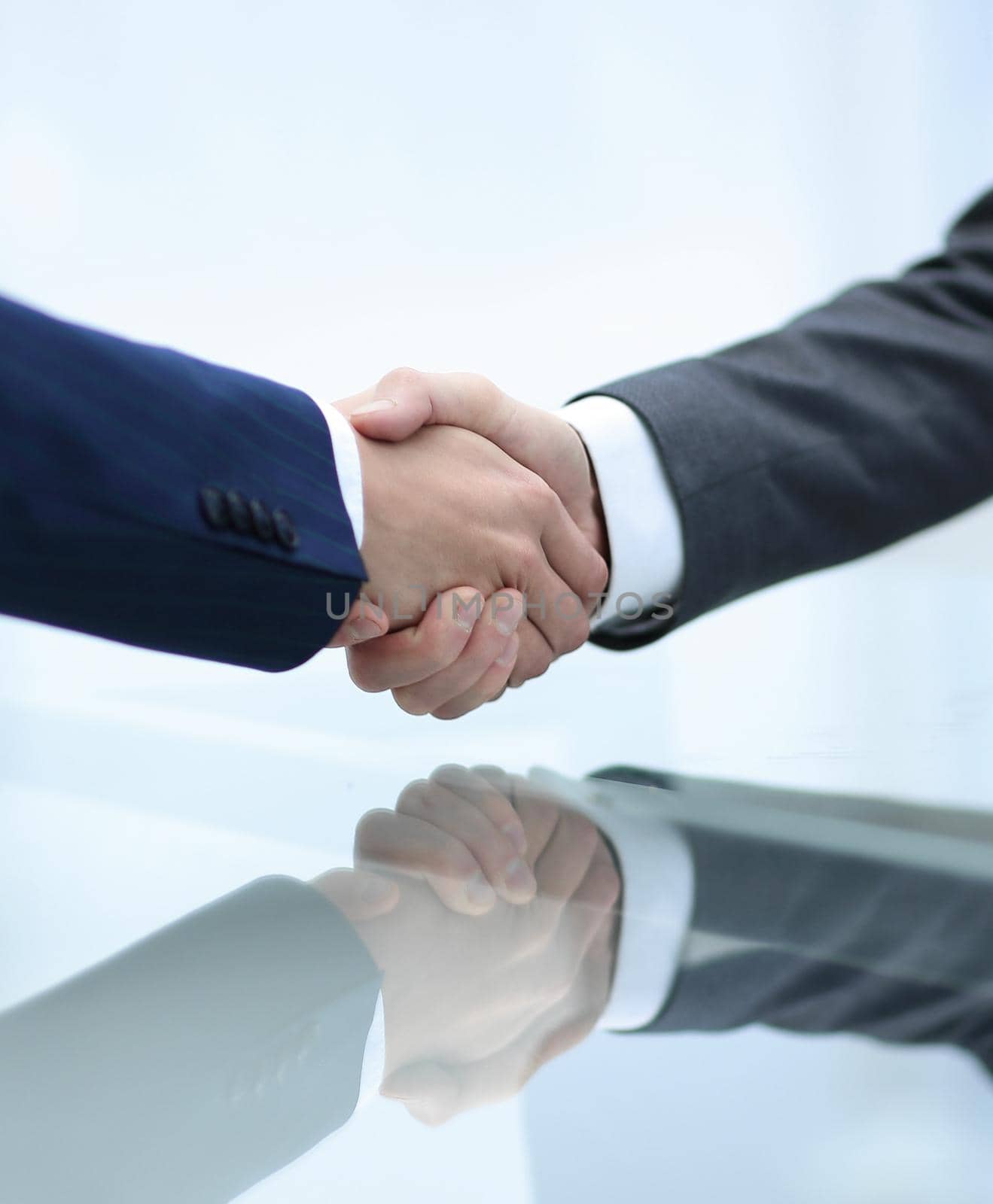 handshake business partners closeup in office