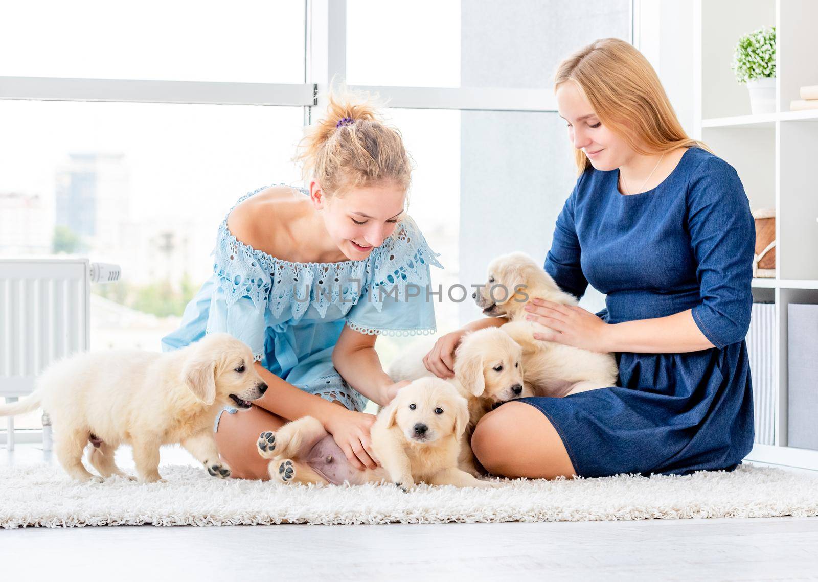Girls playing with puppies by tan4ikk1