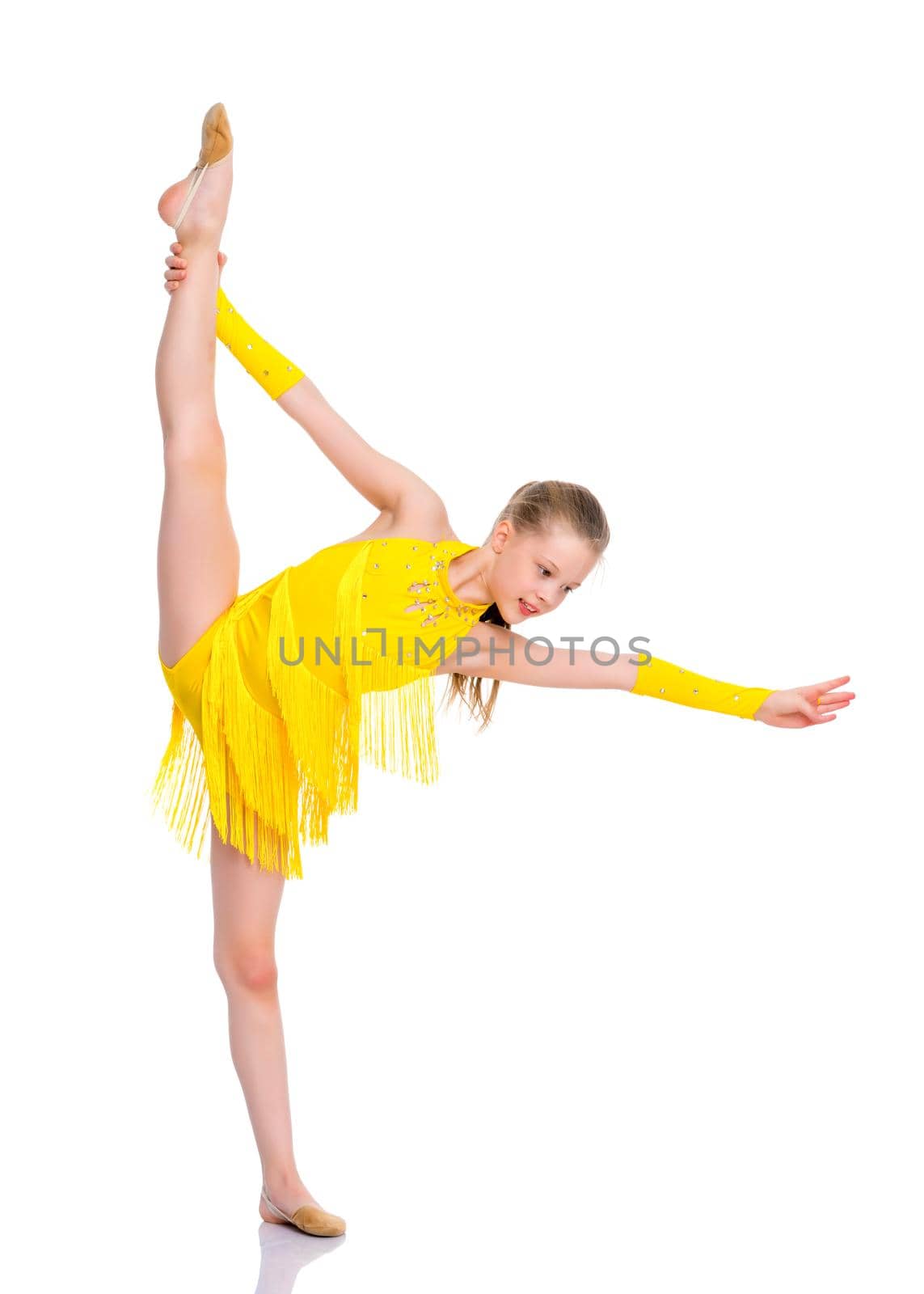 A little girl performs a gymnastic twine. The concept of fitness and sports. Isolated on white background.