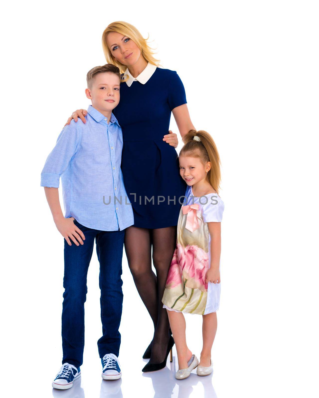 Mother with children holding hands. by kolesnikov_studio