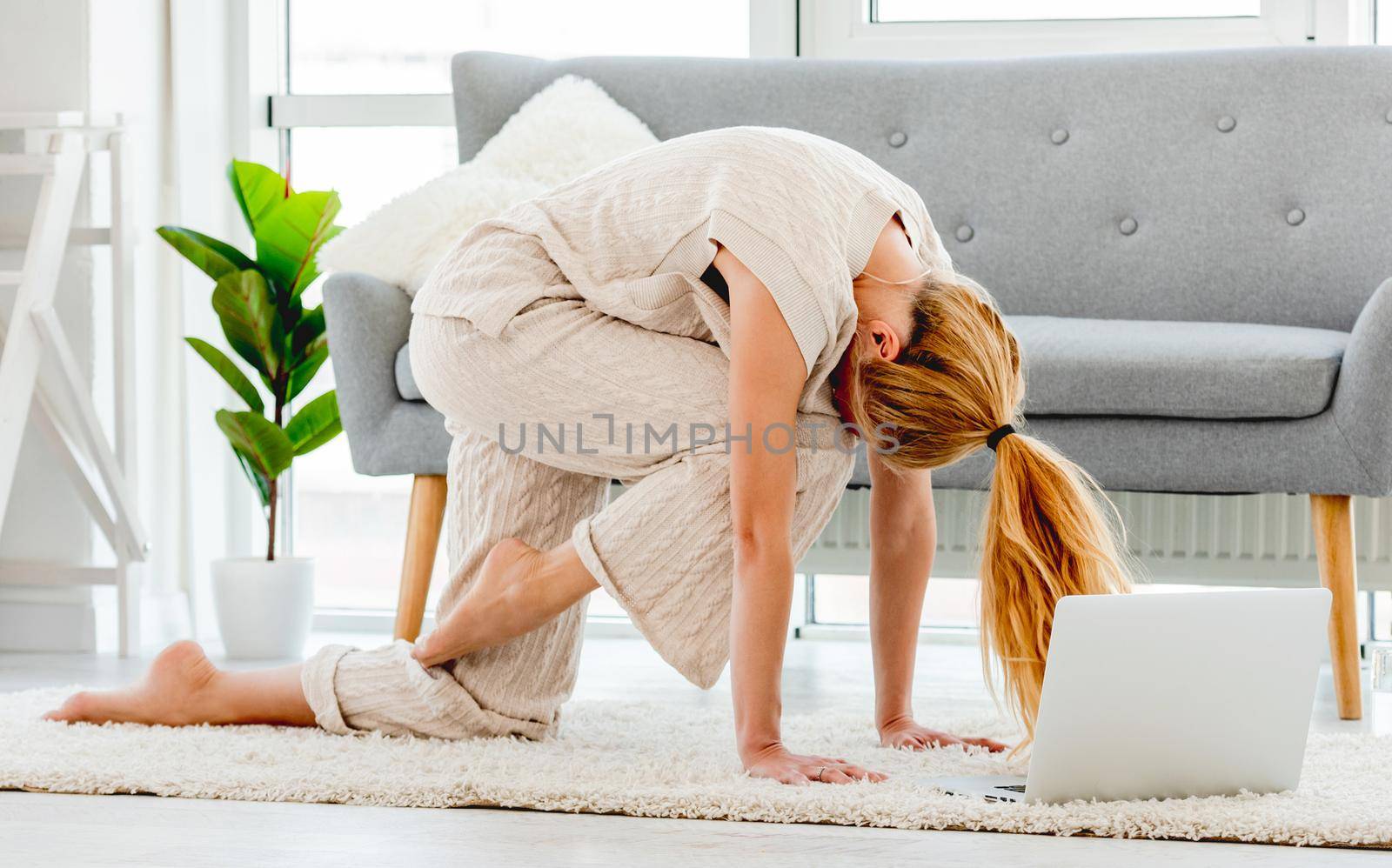Girl making yoga online by tan4ikk1