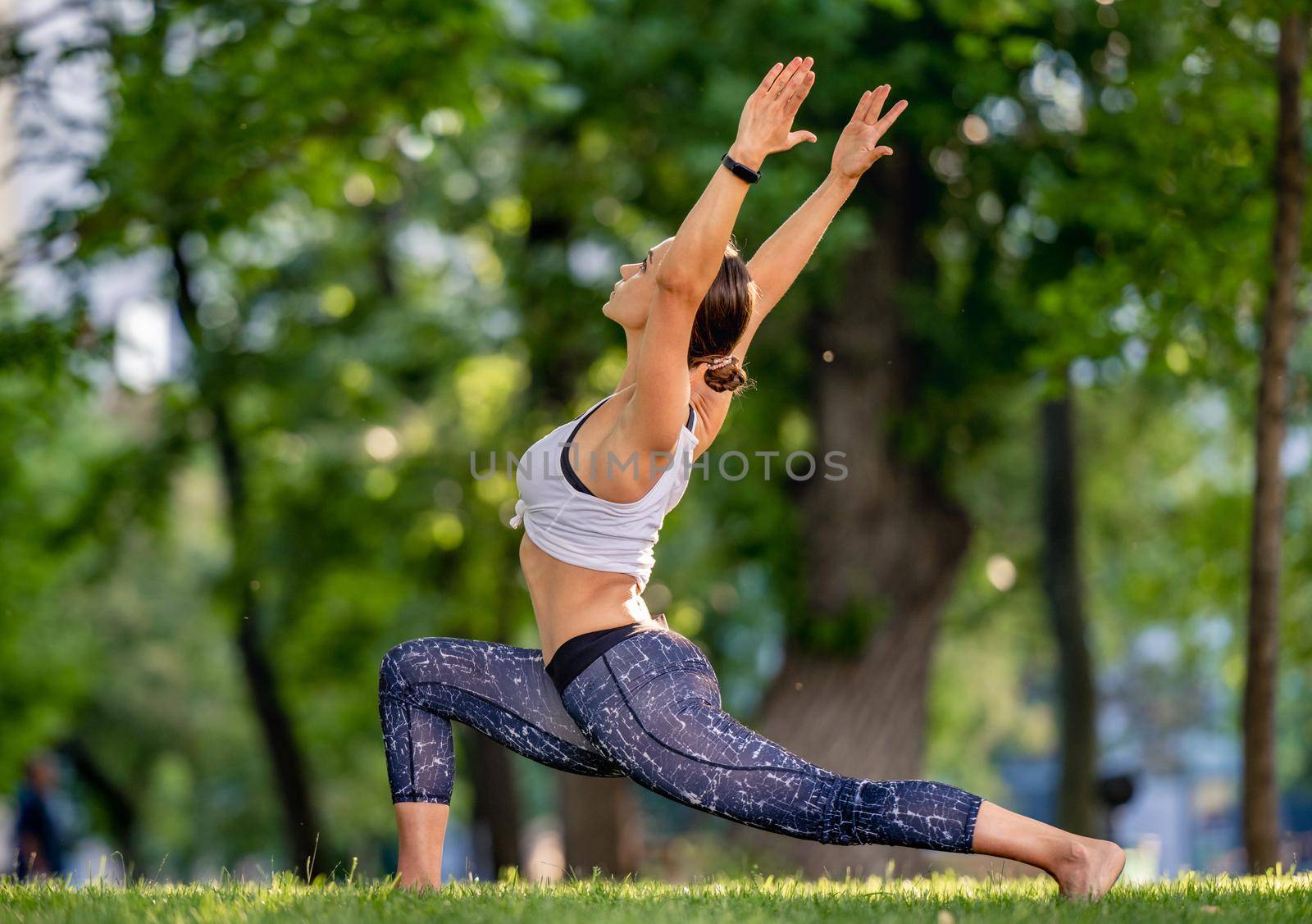 Girl doing yoga at nature by tan4ikk1