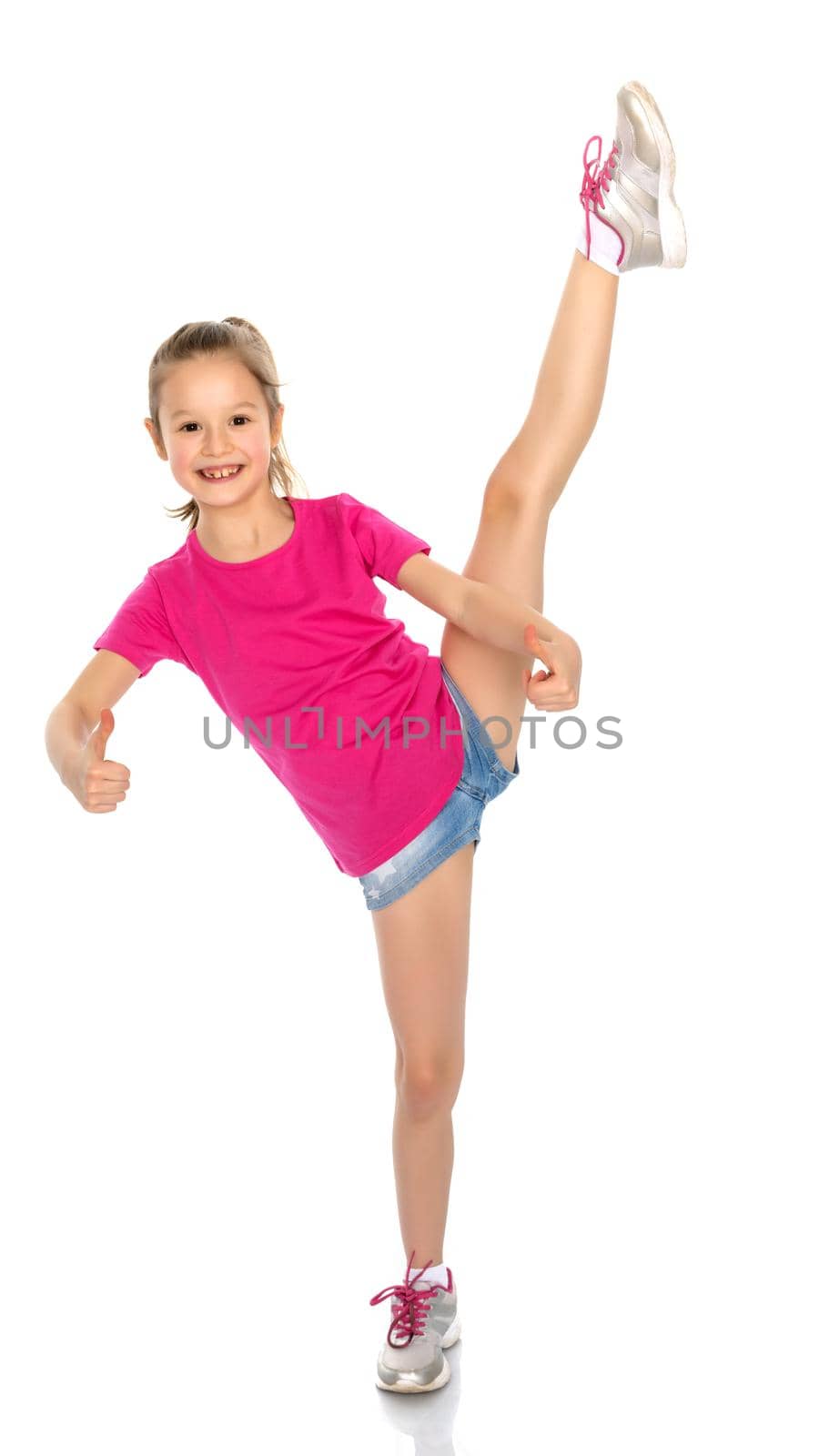 Little girl holding her thumb up. Concept Happy childhood, holiday, birthday.Isolated on white background