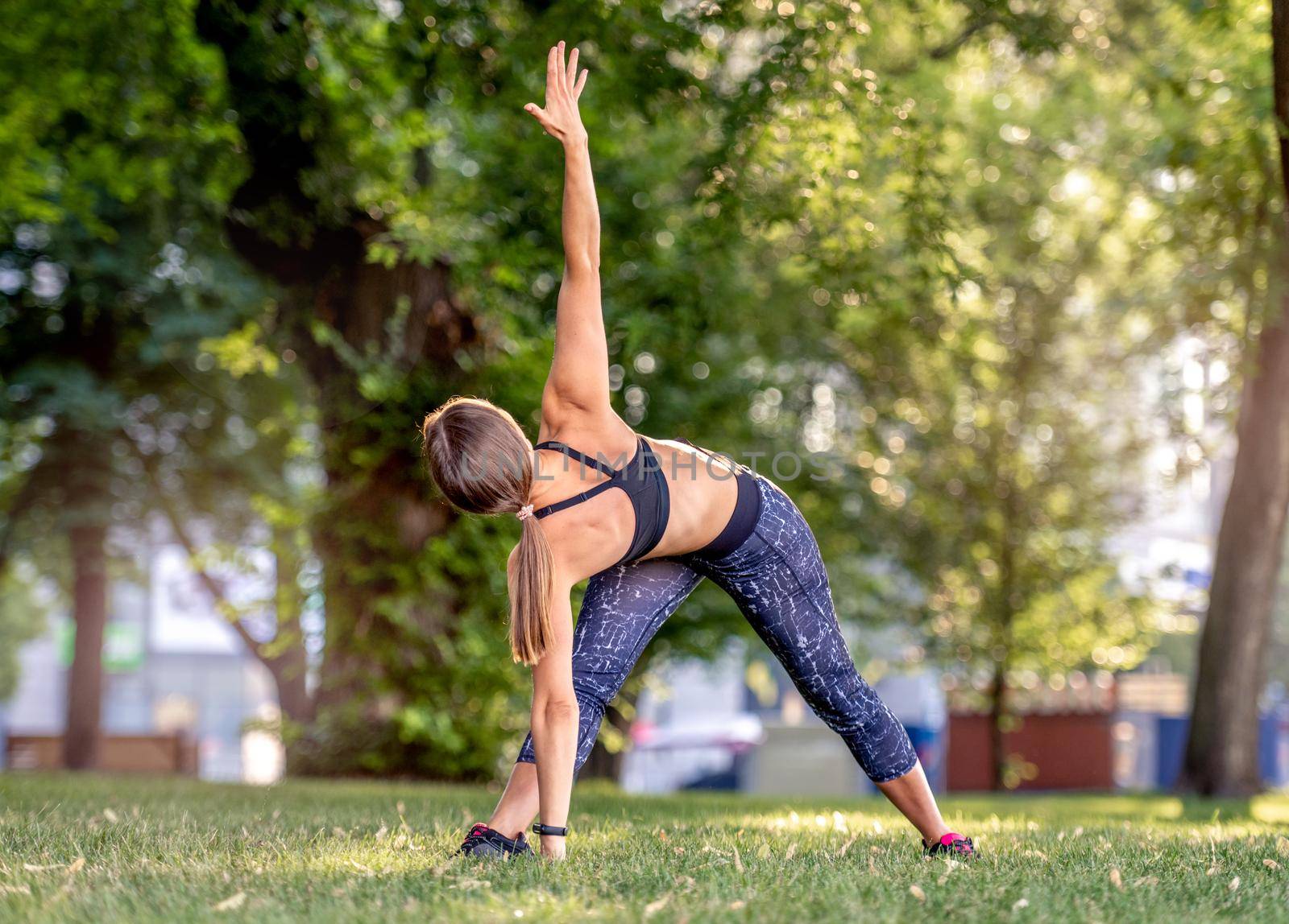 Girl doing yoga at nature by tan4ikk1