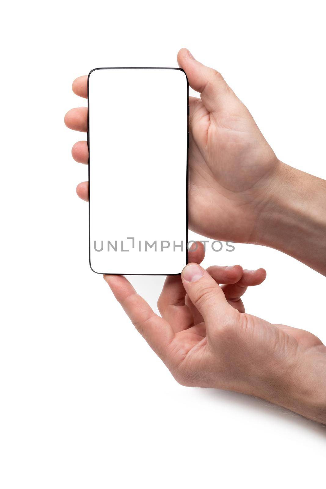 Smartphone with empty screen standing vertically held by hand
