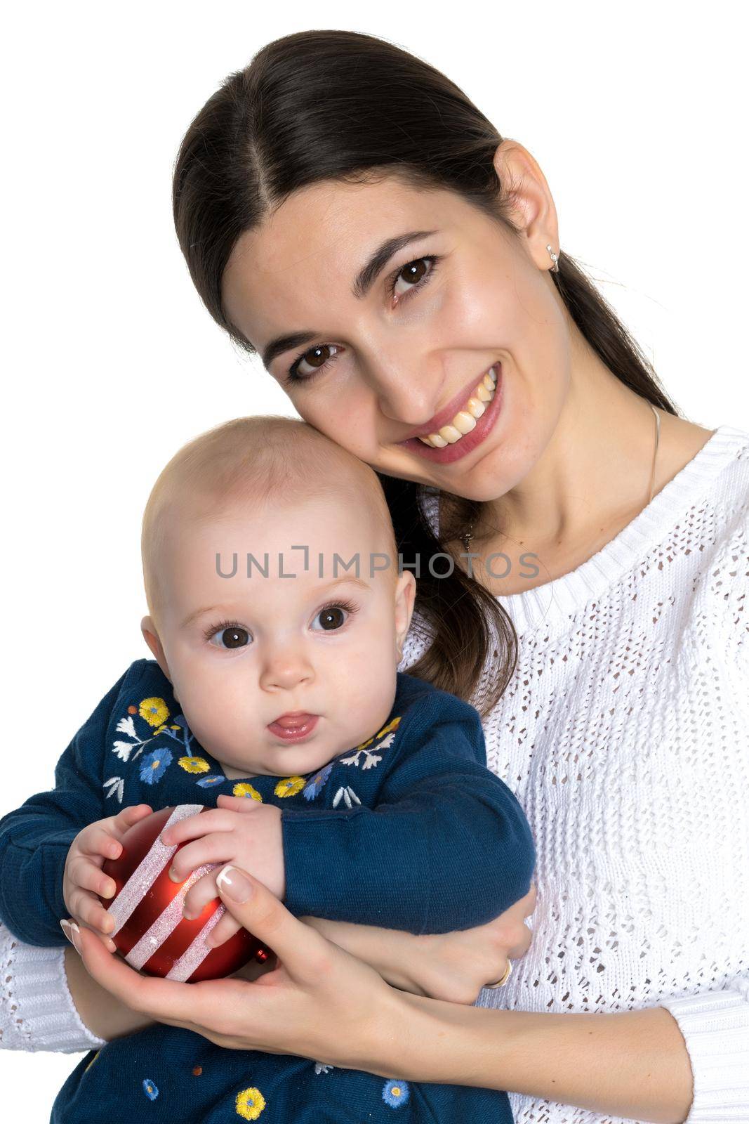 Happy young mother with a little daughter and toy Christmas tree on her hands on Christmas Eve. The concept of a family holiday, a happy childhood. Isolated on white background.