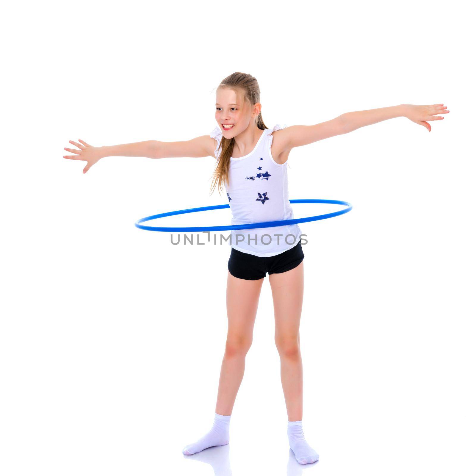 A girl gymnast performs an exercise with a hoop. The concept of gymnastics and fitness. Isolated on white background.