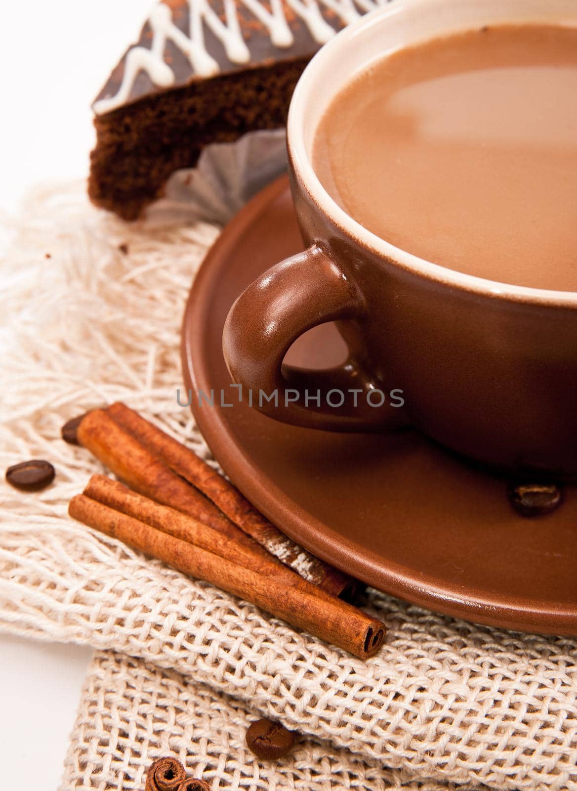 Ceramic cup of coffee with cinnamon by tan4ikk1