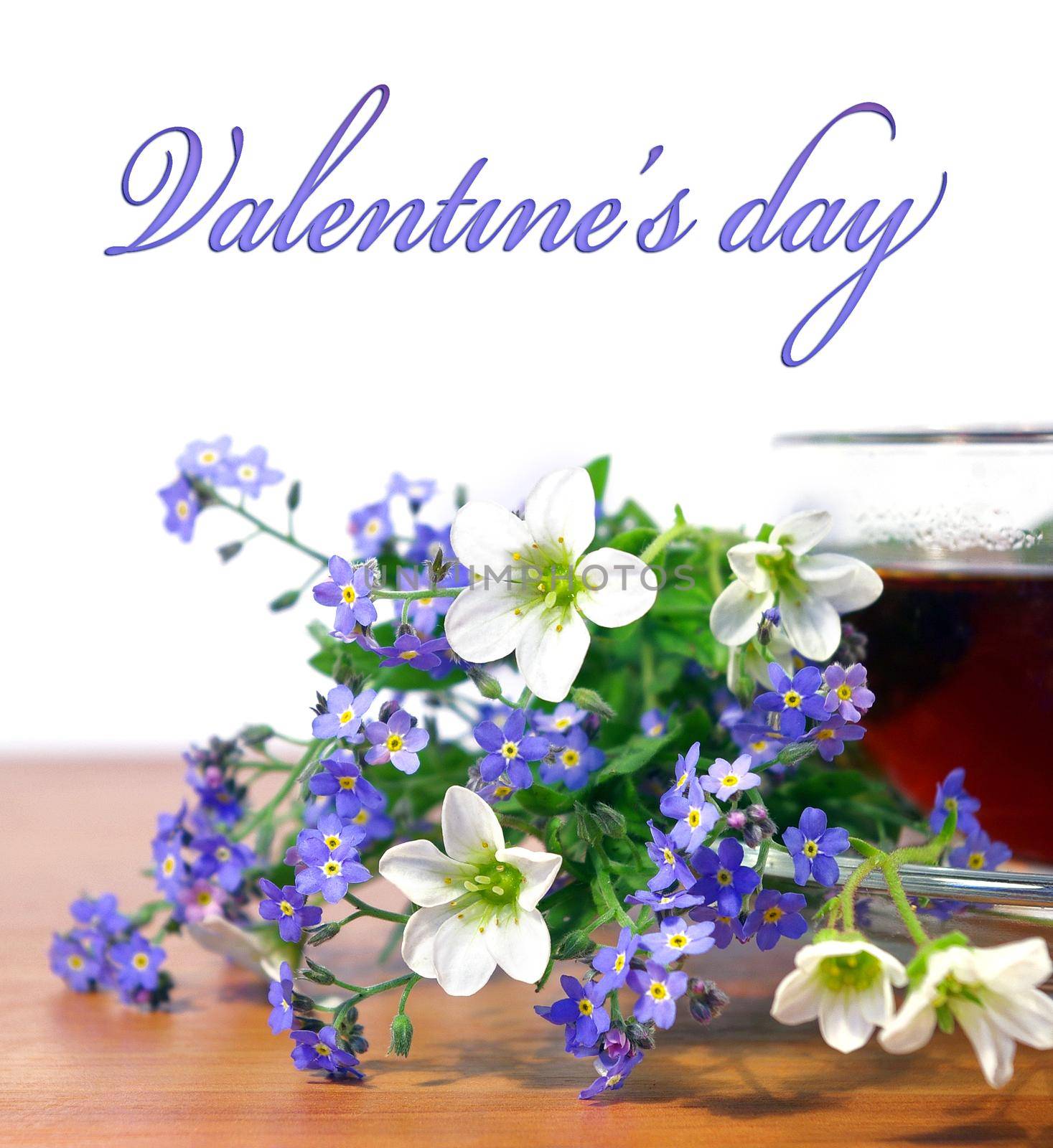 Cup of tea and flowers on white background