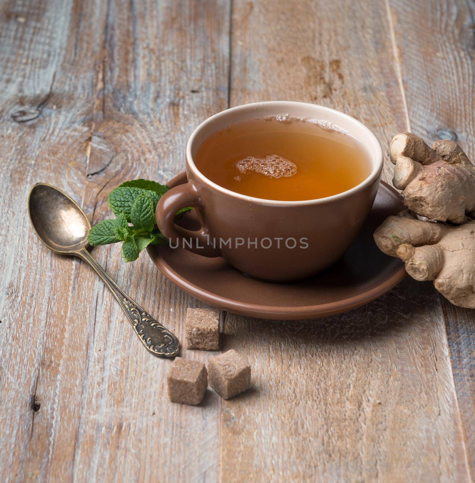 Cup of ginger tea, cubes of brown sugar by tan4ikk1