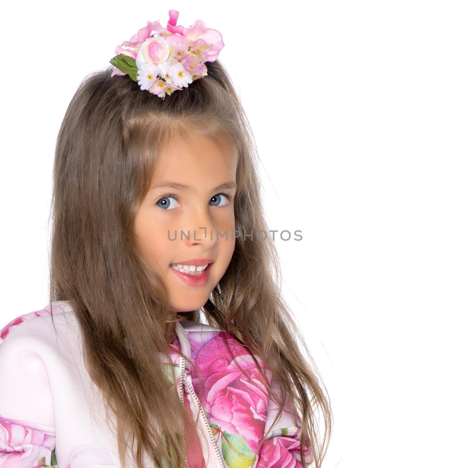 Fashionable little girl in a dress. Beauty and style in children's clothes. Isolated over white background