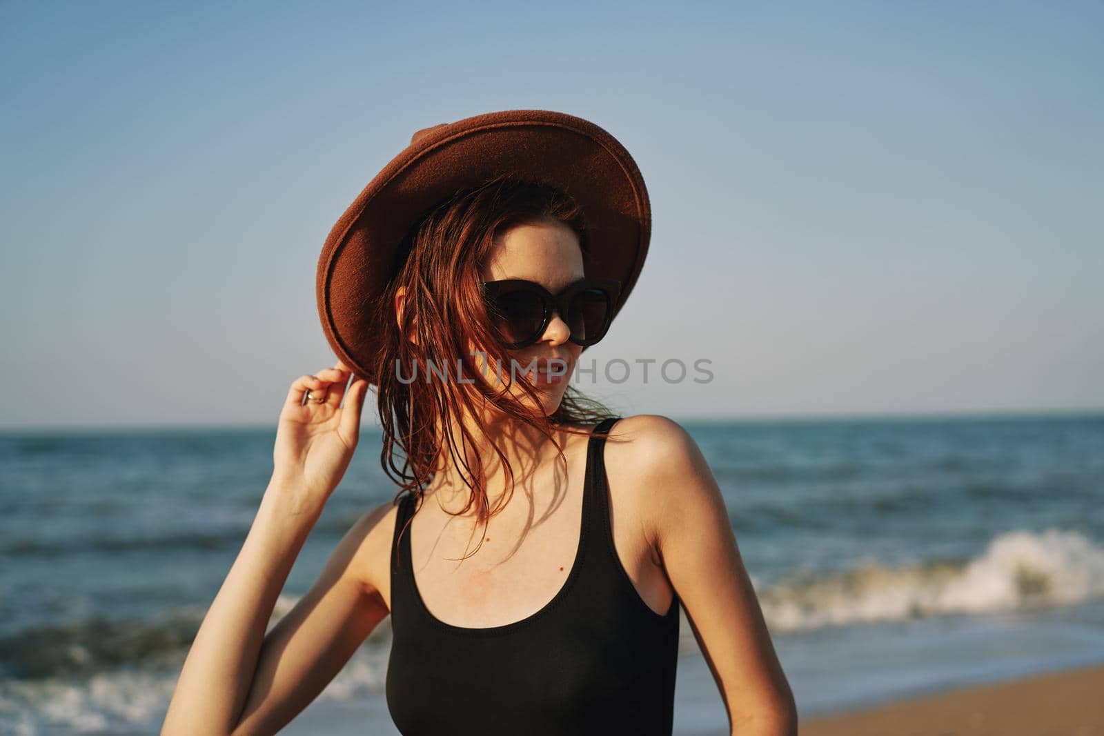 pretty woman on the beach summer vacation lifestyle sun. High quality photo