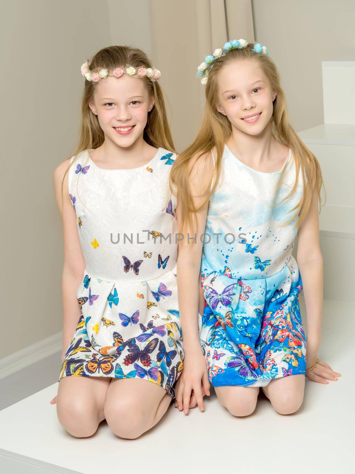 Two beautiful little girls in the studio. by kolesnikov_studio
