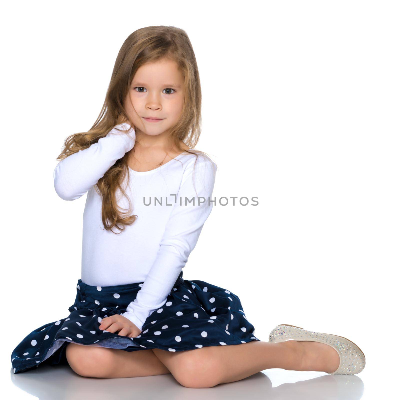 A sweet girl straightens her hair. The concept of fashion and style. Isolated over white background