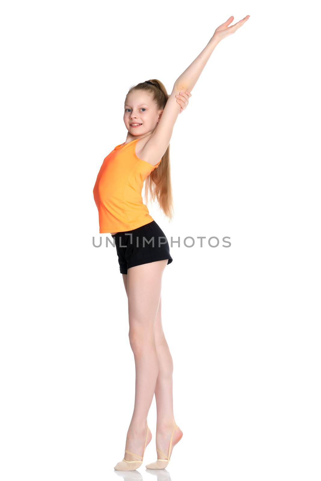 A teenage girl is engaged in fitness. She performs various exercises. The concept of childhood, sport, a healthy lifestyle, physical development of personality. Isolated on white background.