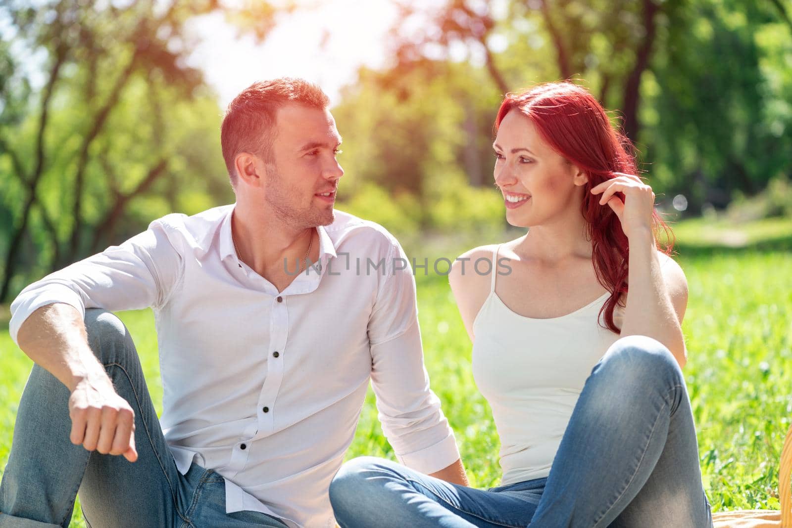 Young couple on a date in the park by adam121